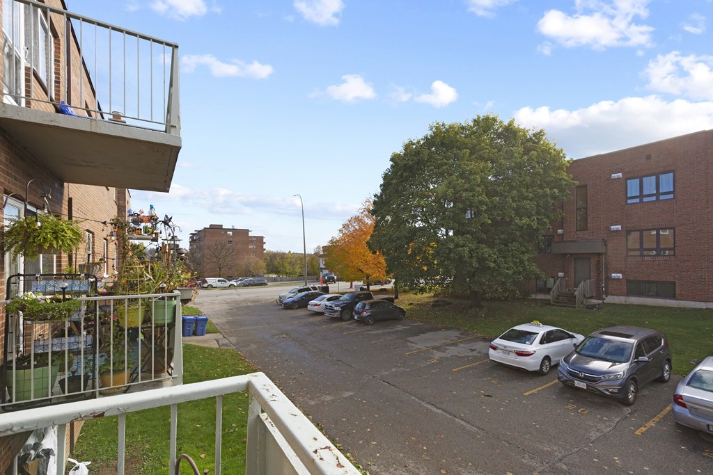 a parking lot in front of a brick building
