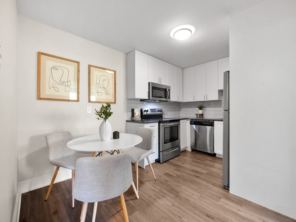 a kitchen and dining area in a 555 waverly unit