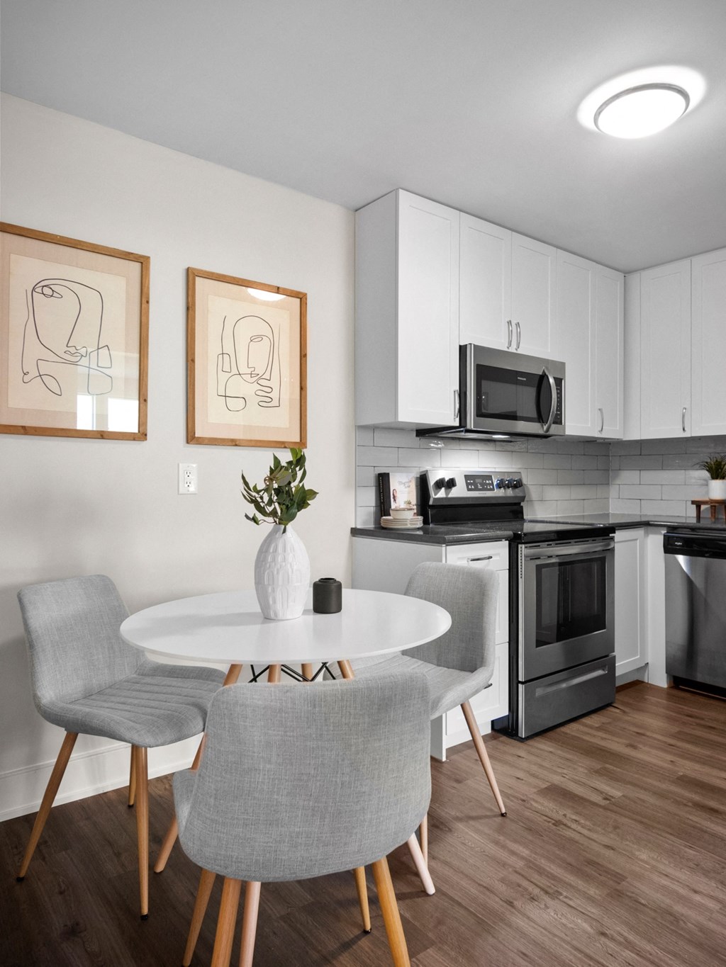 a kitchen and dining area in a 555 waverly unit