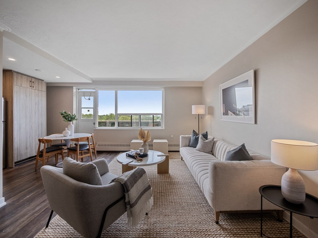 a living room with a couch and two chairs