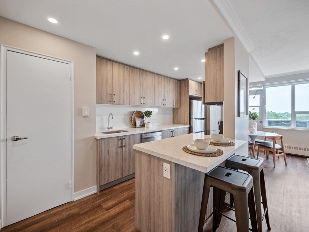 a kitchen and dining area in a 555 waverly unit
