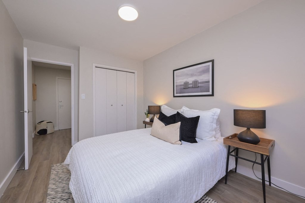 a bedroom with a large bed in a room