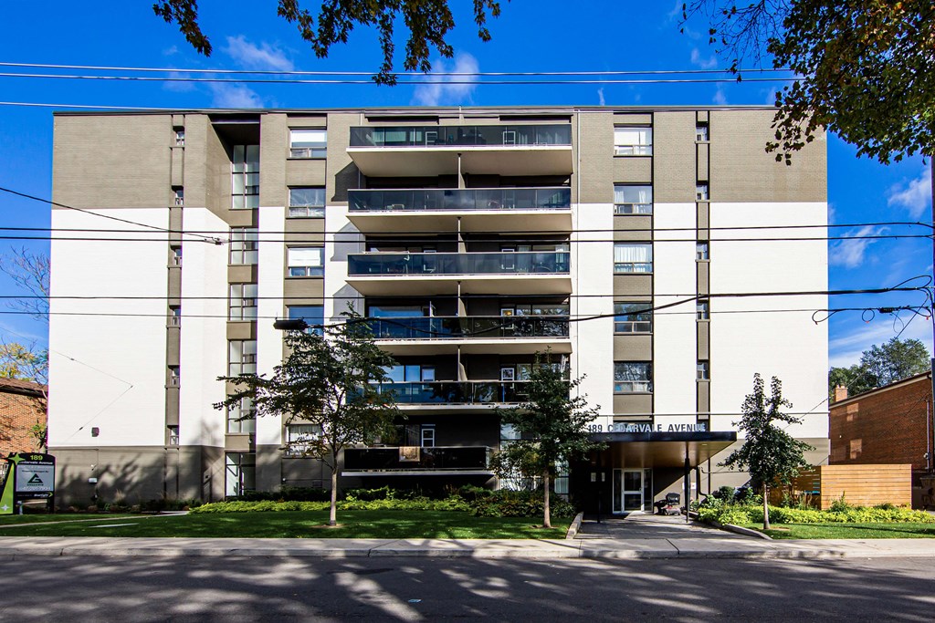 a view of the front of the building with a clear blue sky in the background