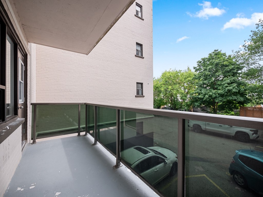 a view of the parking lot from the balcony