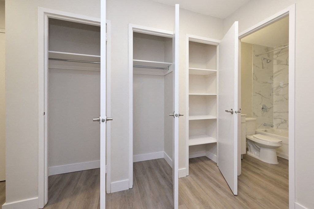 a walk in closet in a 555 waverly unit