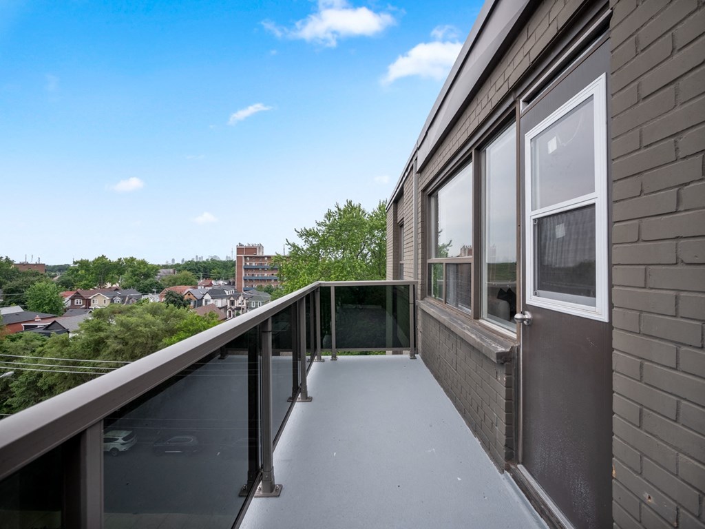 a balcony with a view of the city