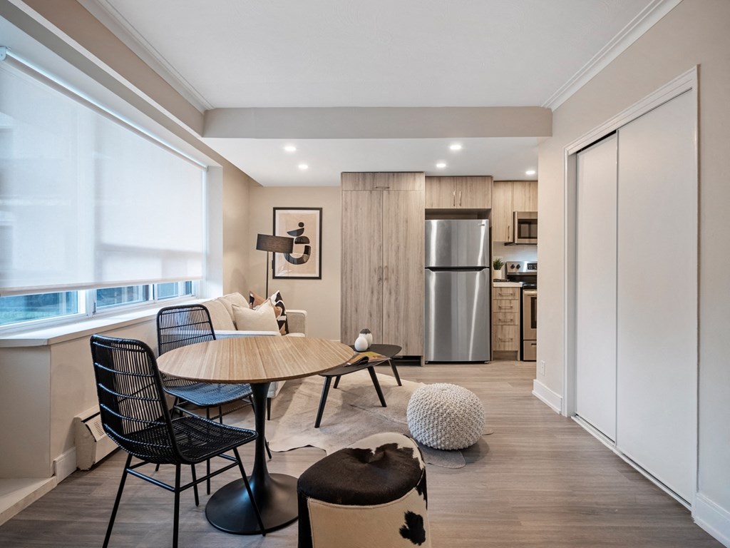 a kitchen and dining area in a 555 waverly unit