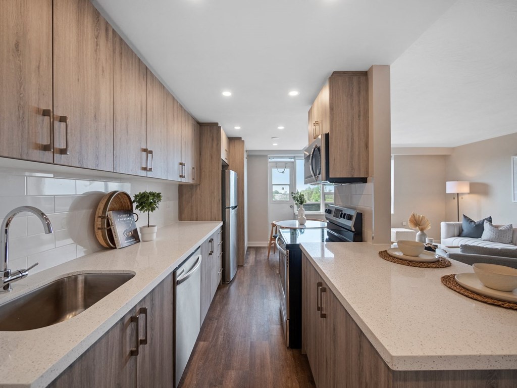a kitchen and living room in a 555 waverly unit