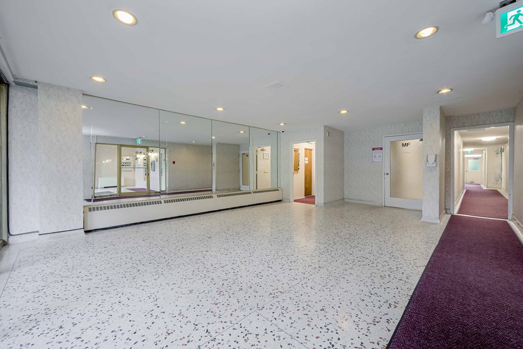 a large room with a large mirror