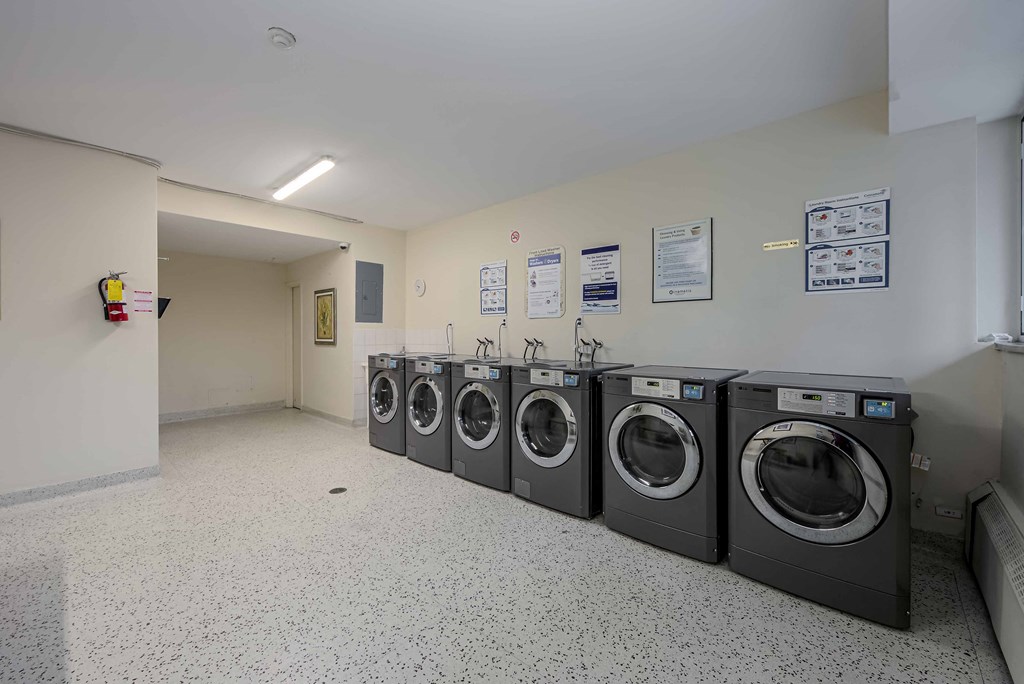 a row of washing machines in a laundromat