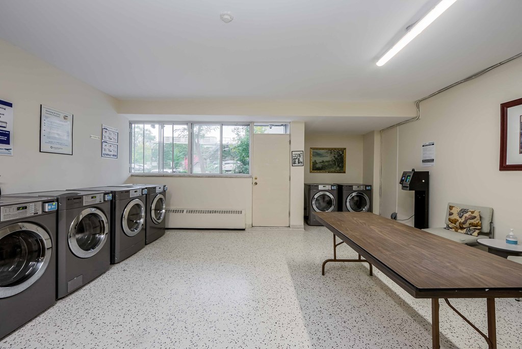 a washer and dryer room in a laundromat
