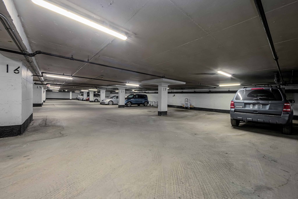 a parking garage with a car parked in it