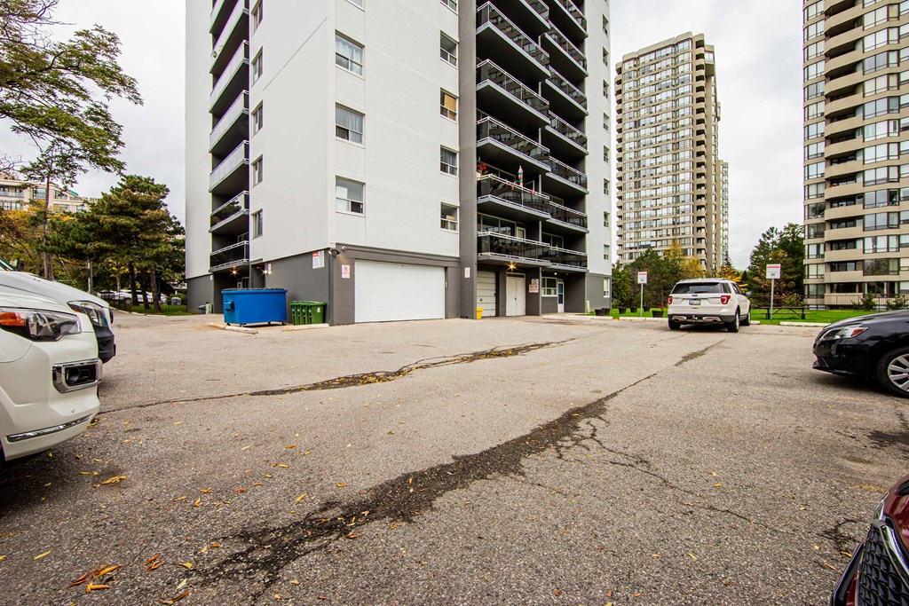 a parking lot in front of an apartment building