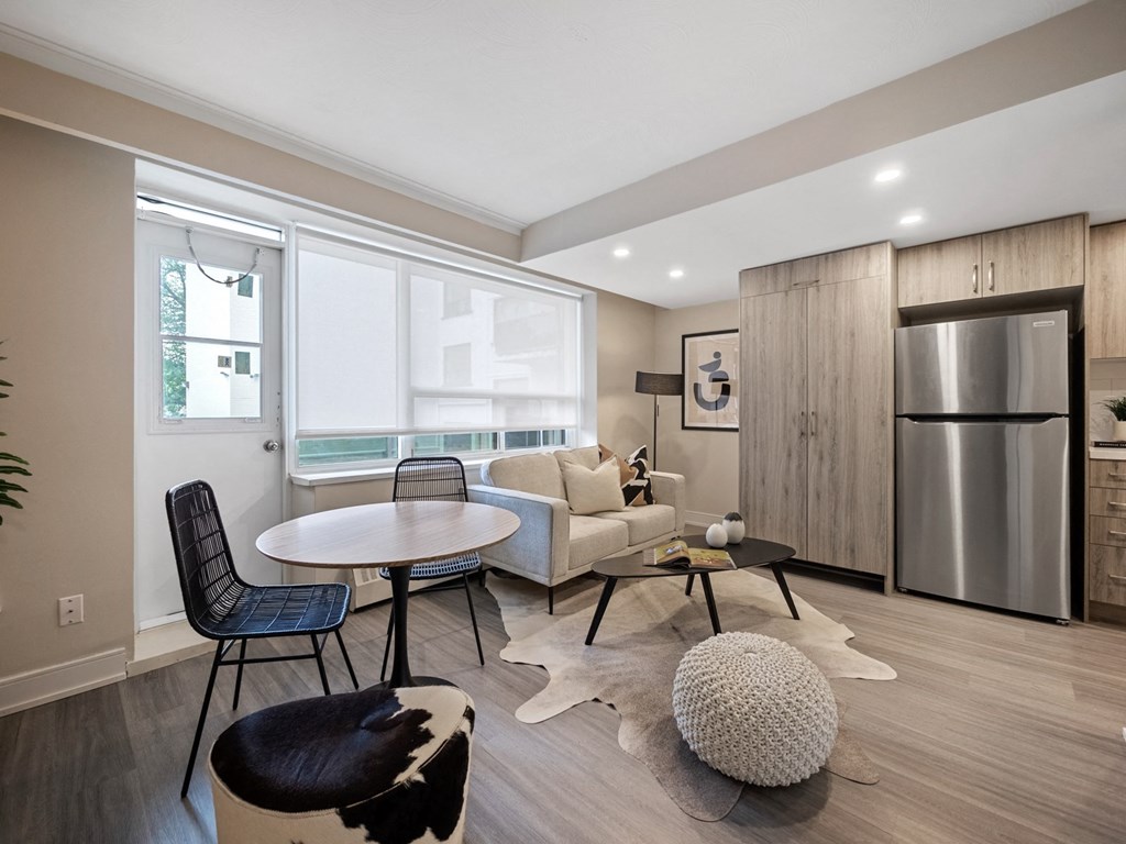 a living room with a table and chairs
