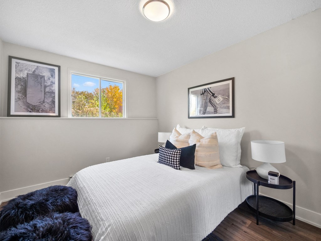 a bedroom with a bed and a nightstand