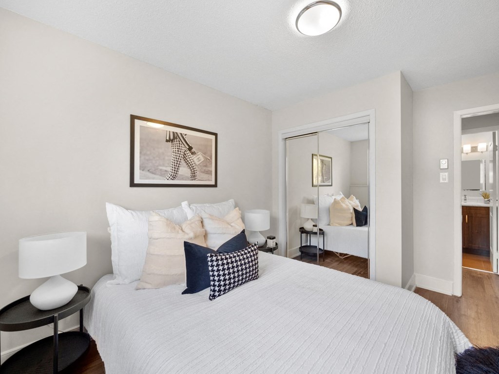 a bedroom with a bed and a doorway to a bathroom