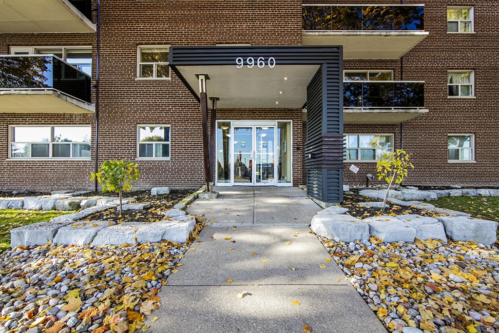 a large brick building with a glass door
