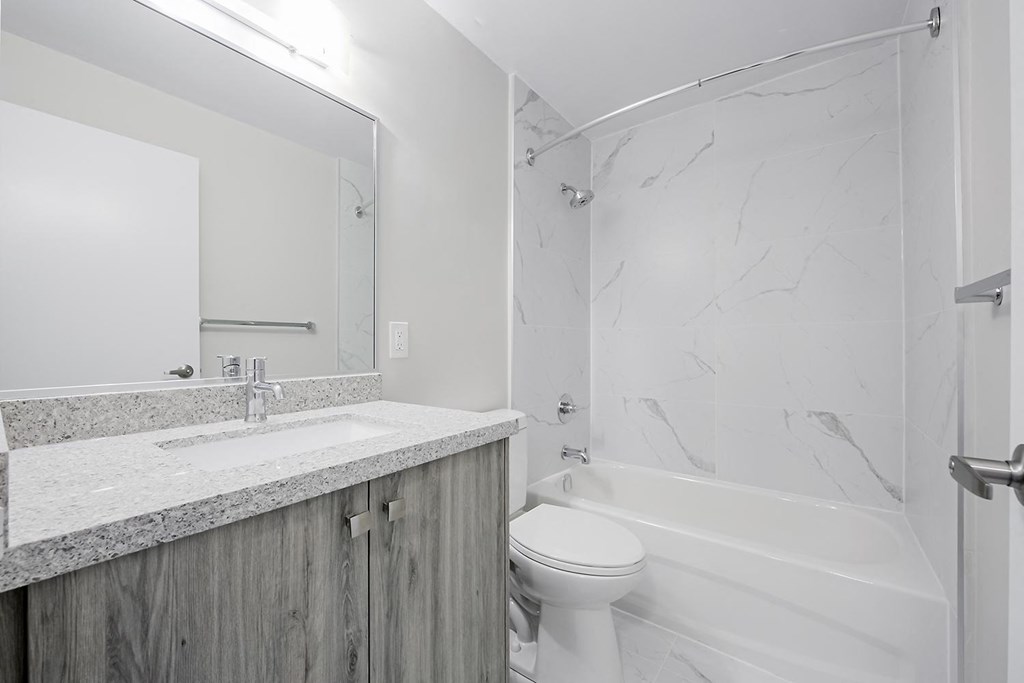 a bathroom with a sink toilet and bathtub