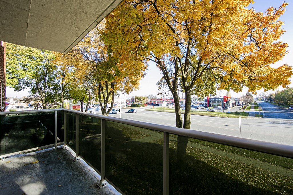 a balcony with a view of a street