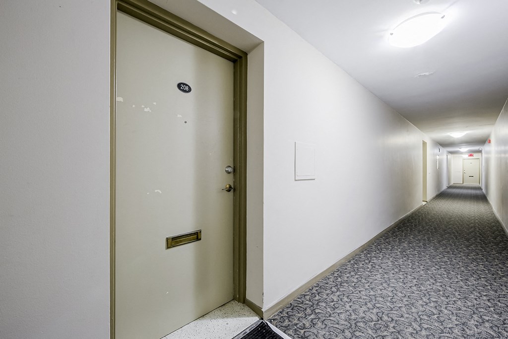 a door at the end of a long corridor