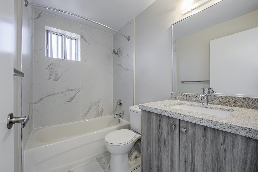 a bathroom with a sink toilet and bathtub