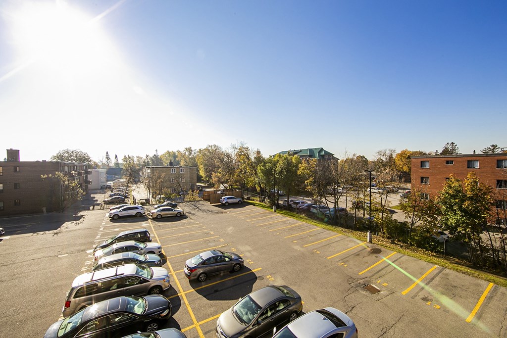 a parking lot with a building in the background