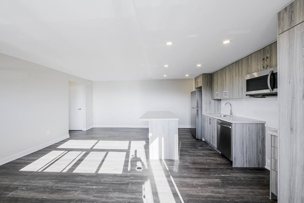a kitchen and dining area in a 555 waverly unit