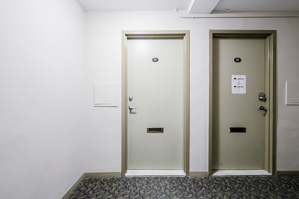 a pair of doors in a white room