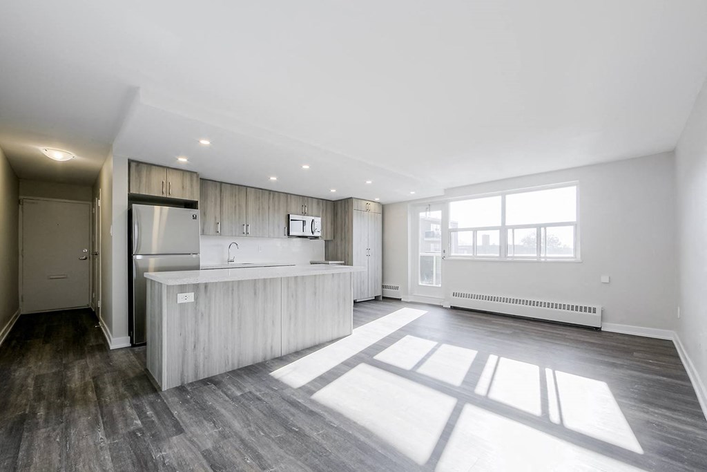 a kitchen with a large center island and a stove top oven