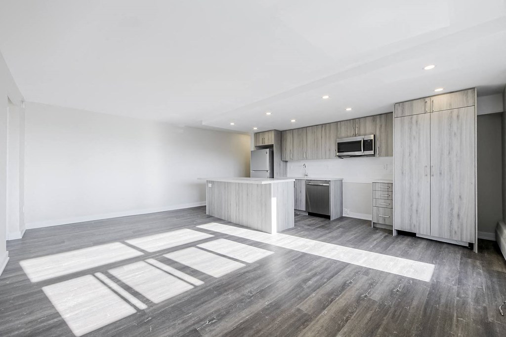 a kitchen and living area in a 555 waverly unit
