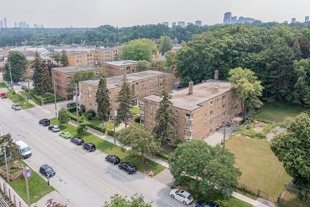 a view from the top of a building of a large brick building with a long chimney