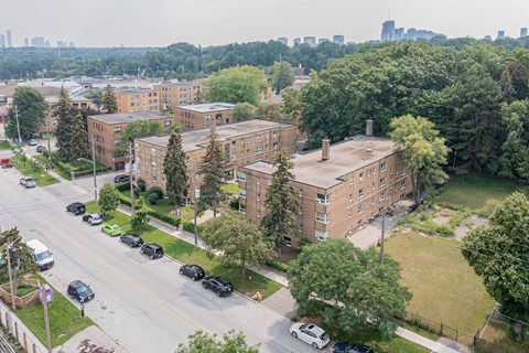 a view from the top of a building of a large brick building with a long chimney