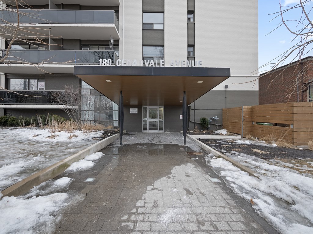 a view of the front of the building with snow on the ground