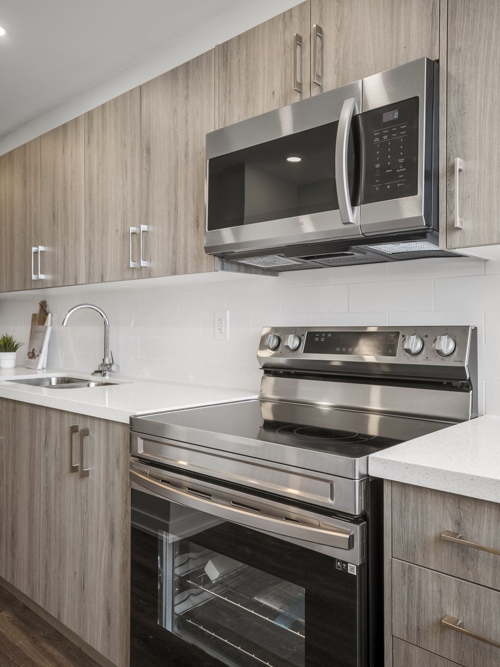 a kitchen with a stove top oven next to a sink