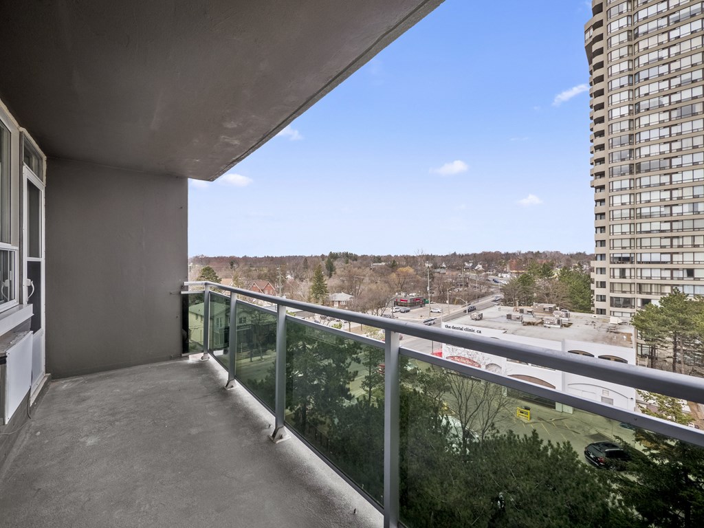 a balcony with a view of a city