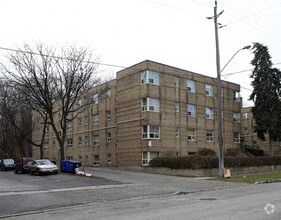 a large brown building sitting on the side of a road