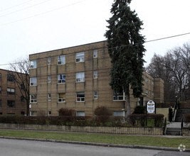 a large building with a tree in front of it