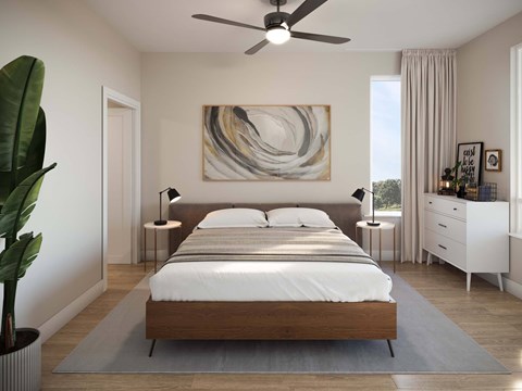 A modern bedroom with a large bed and a painting on the wall.