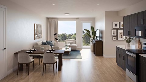 A modern kitchen and dining area with a view of the outdoors.