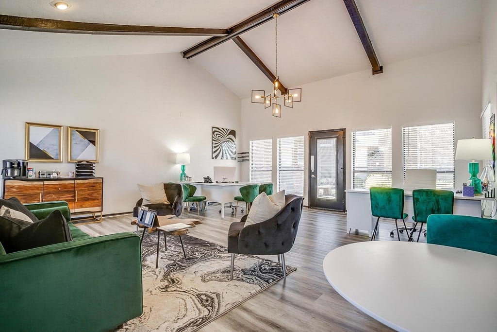 a living room with a table and chairs and a dining room
