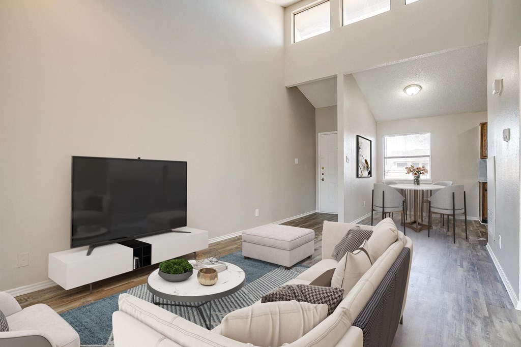 a living room with a couch and a tv