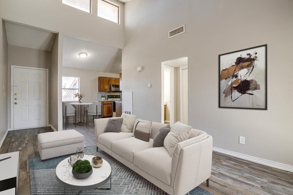a living room with a white couch and a table