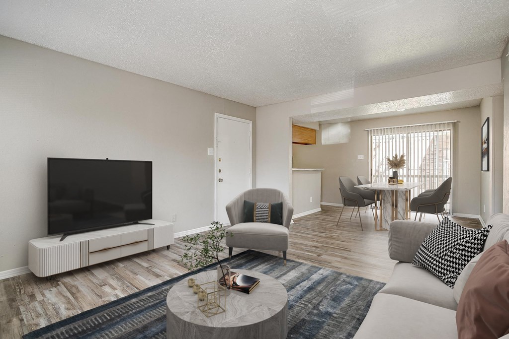 our apartments offer a living room with a tv and a dining room