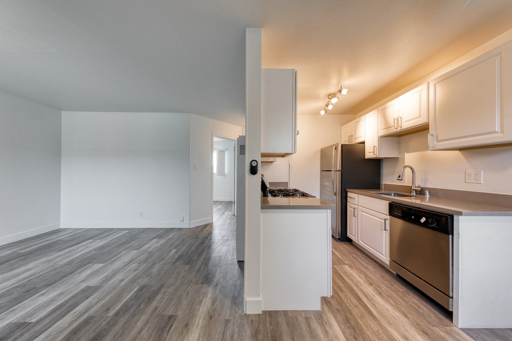 a kitchen and living room in a 555 waverly unit