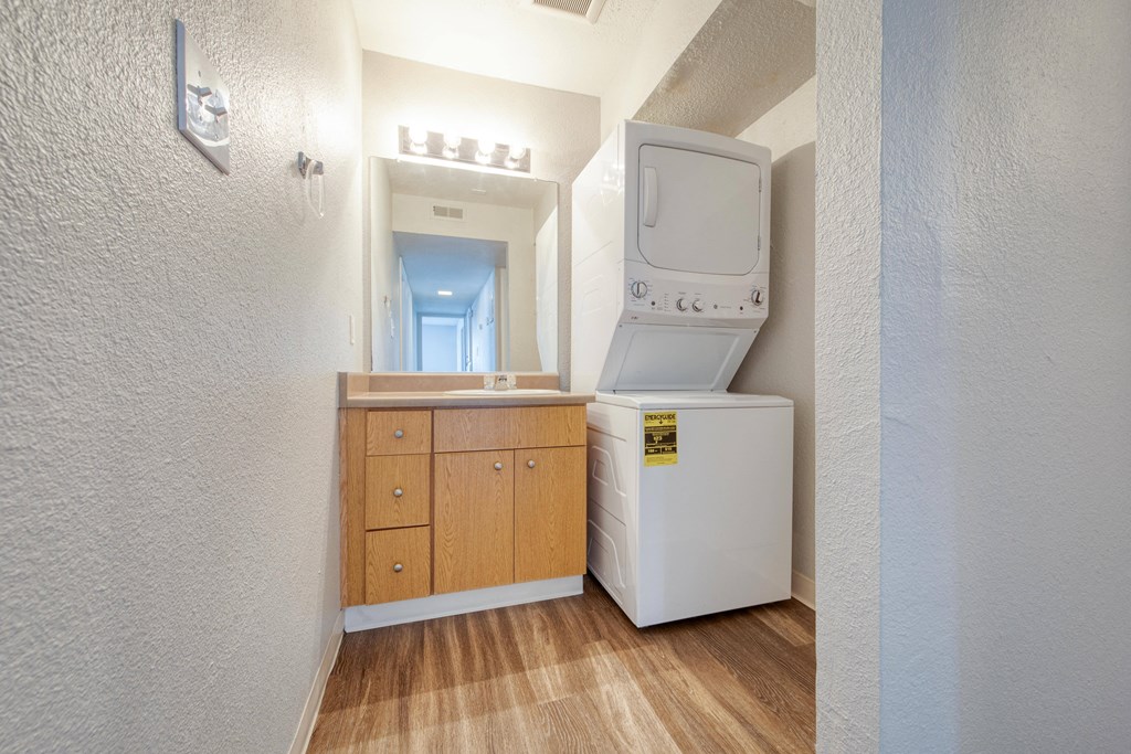 a room with a washer and dryer in it