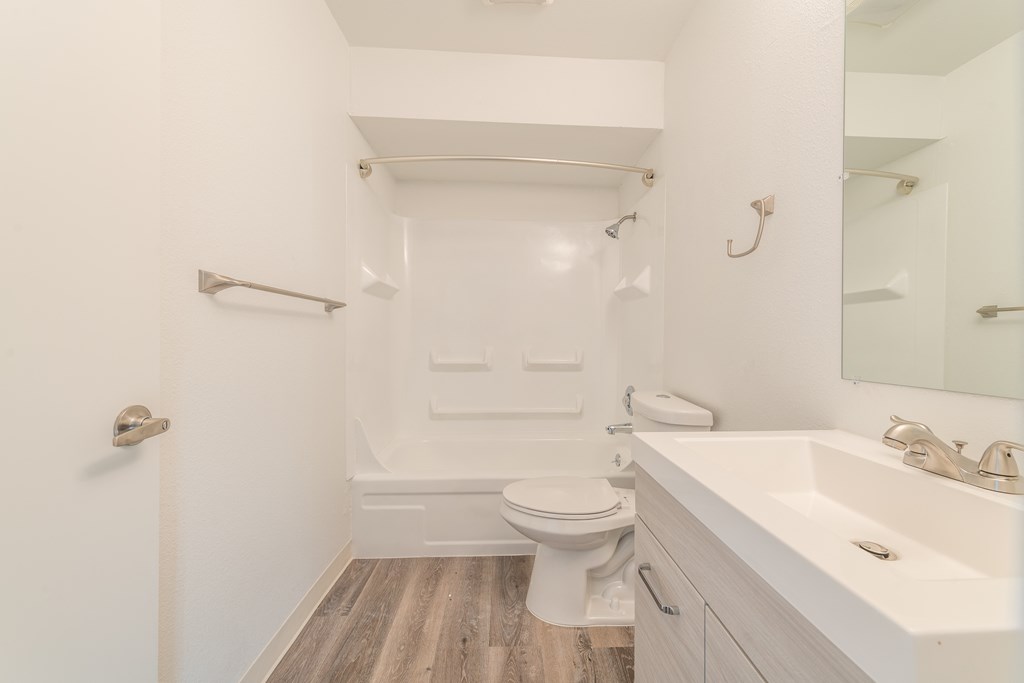 a bathroom with a toilet sink and bathtub