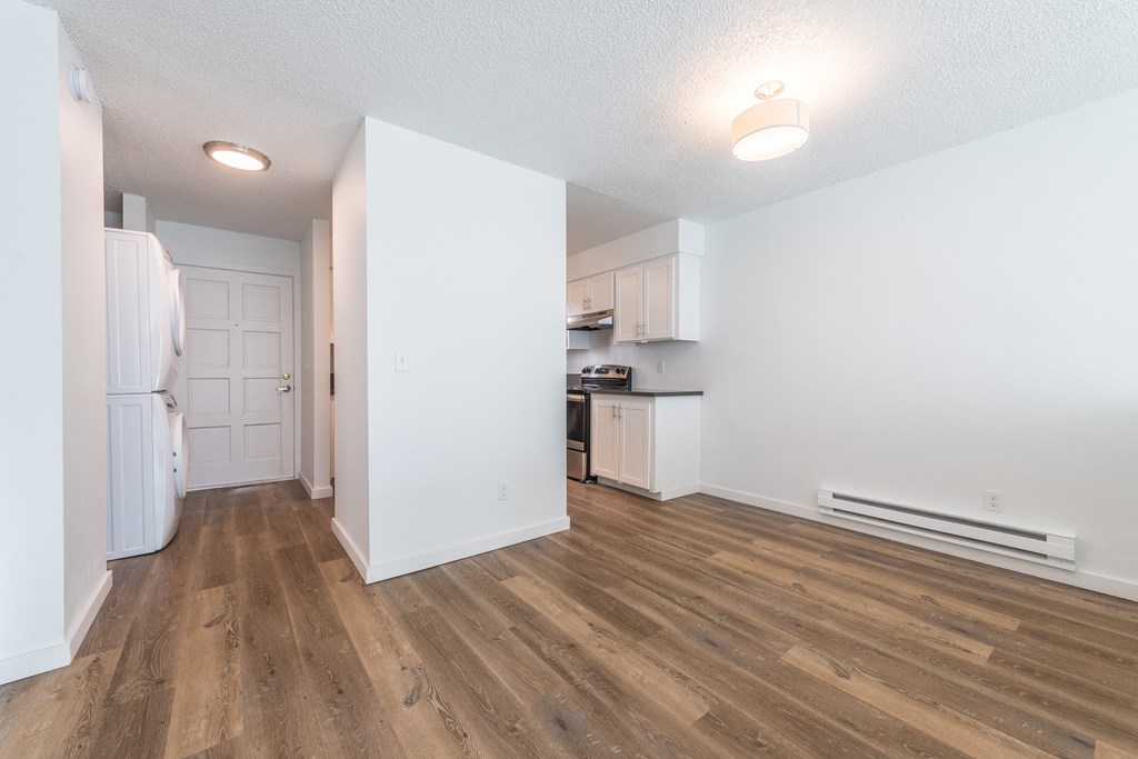 a kitchen and living room in a 555 waverly unit
