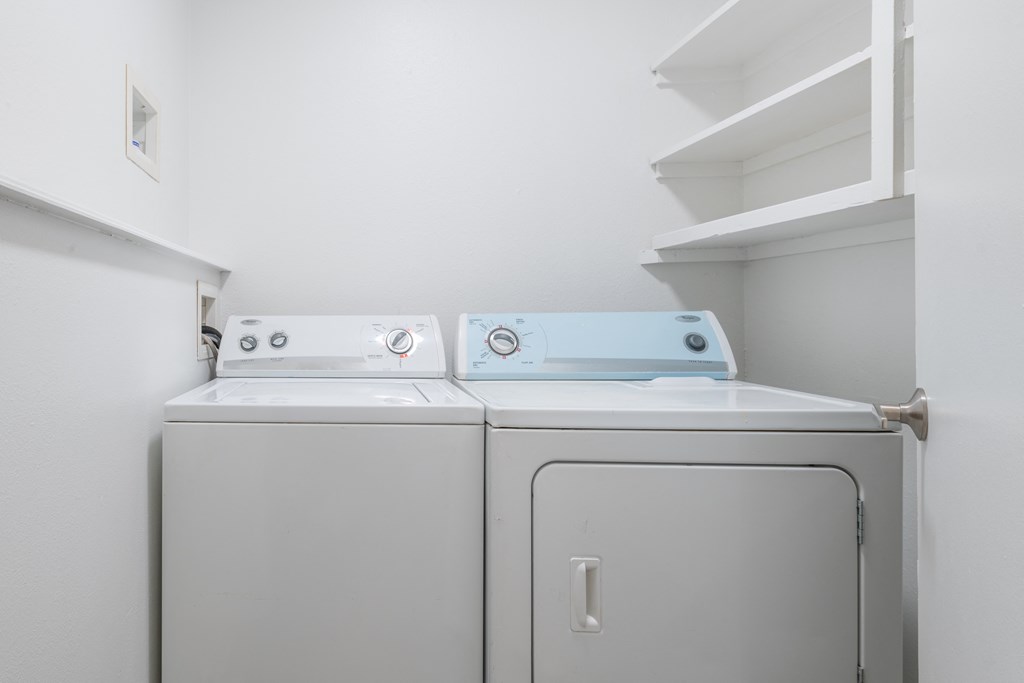 a laundry room with a washer and dryer