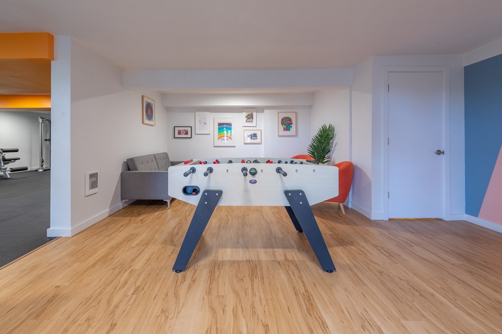 a games room with a foosball table