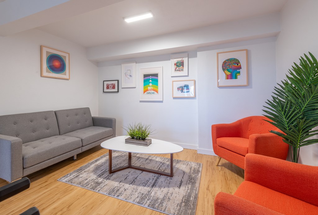 a living room with couches chairs and a coffee table